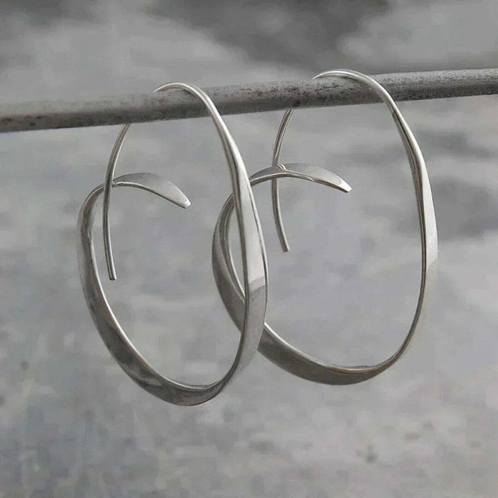 Spiral Drop Earrings with Open Design
