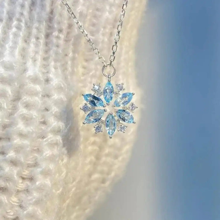 White Gold Flower Pendant Necklace with Blue Snowflake Accent